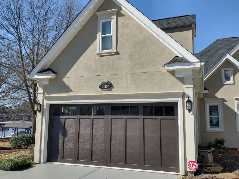 A handsome home exterior with a new garage door